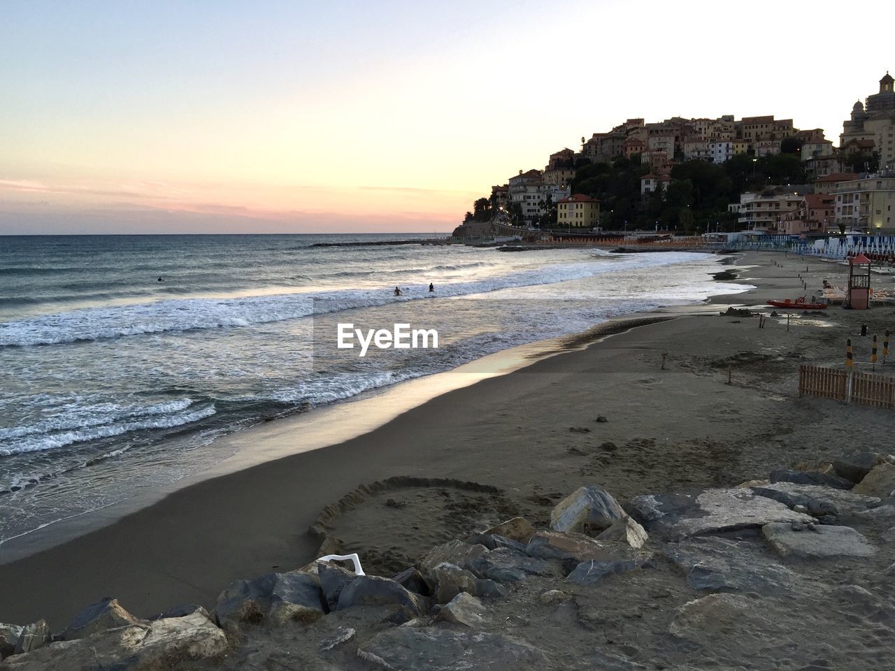 Scenic view of beach against sky during sunset