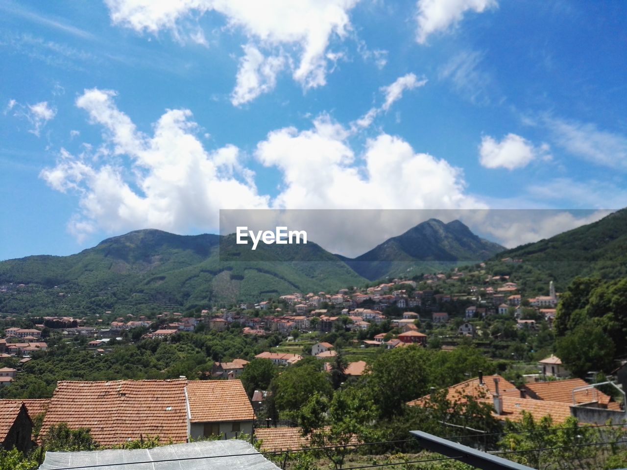 TOWNSCAPE AGAINST MOUNTAINS