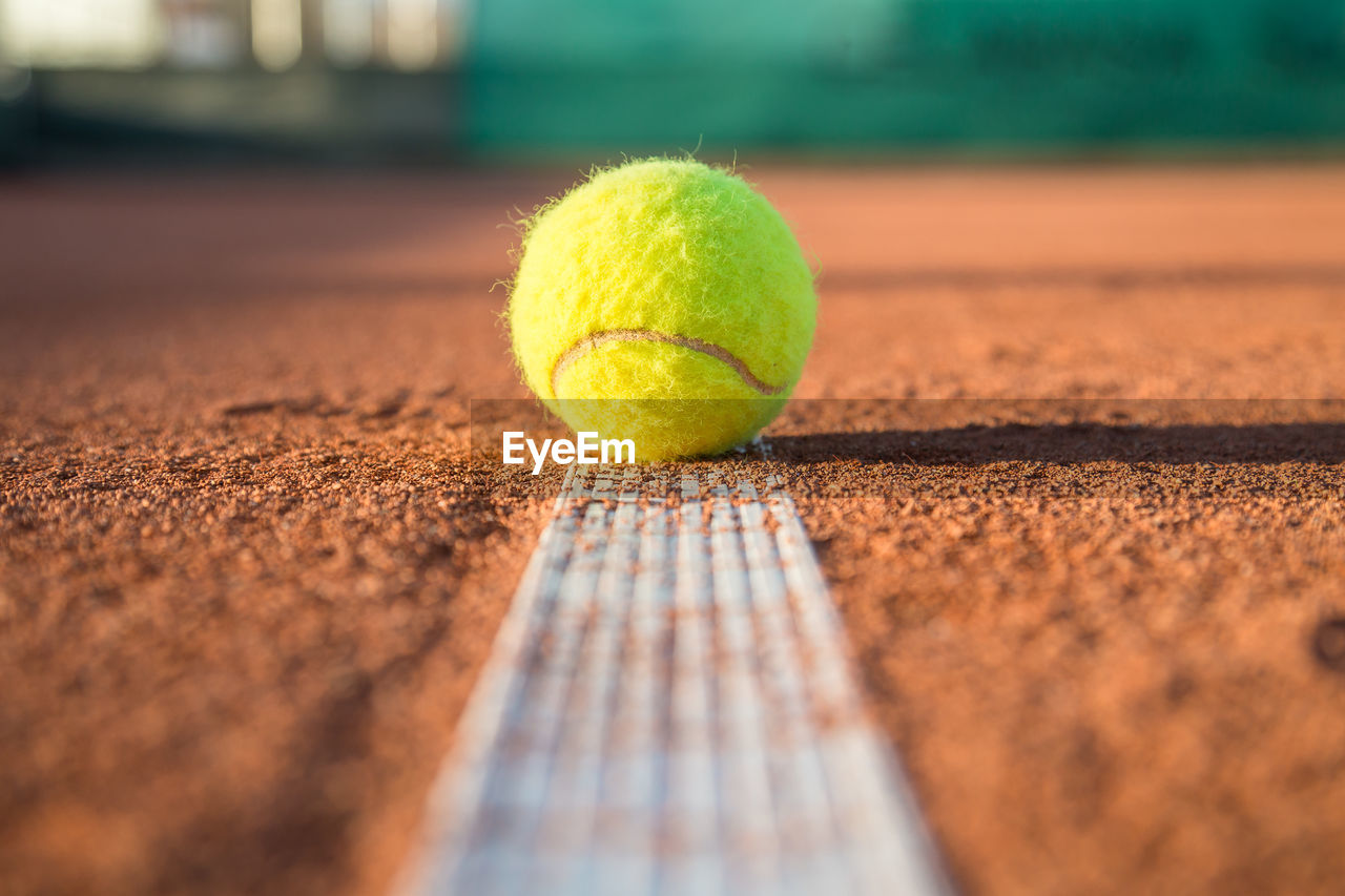 Close-up of tennis ball on field