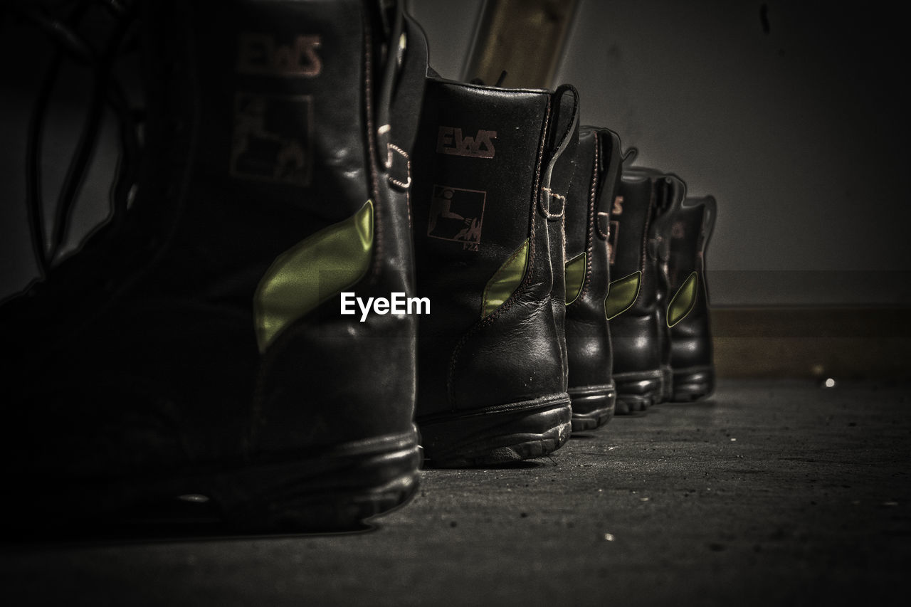 Firefighter boots arranged on floor