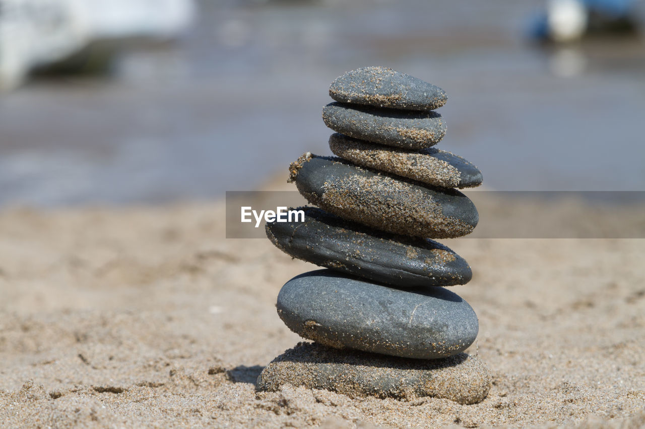 CLOSE-UP OF STONE STACK ON ROCK