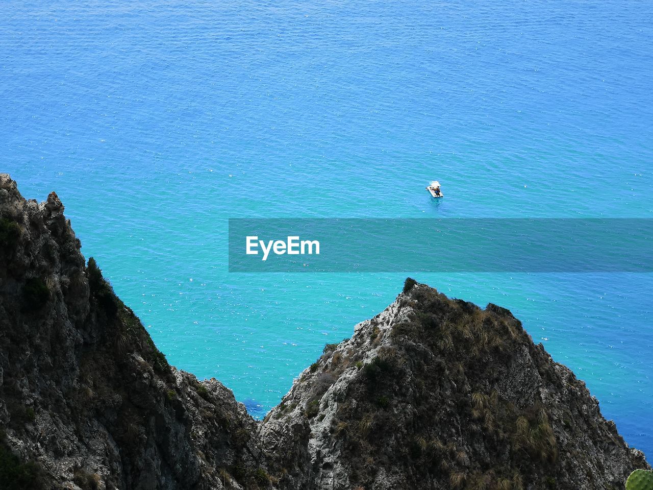 High angle view of rock formation by sea