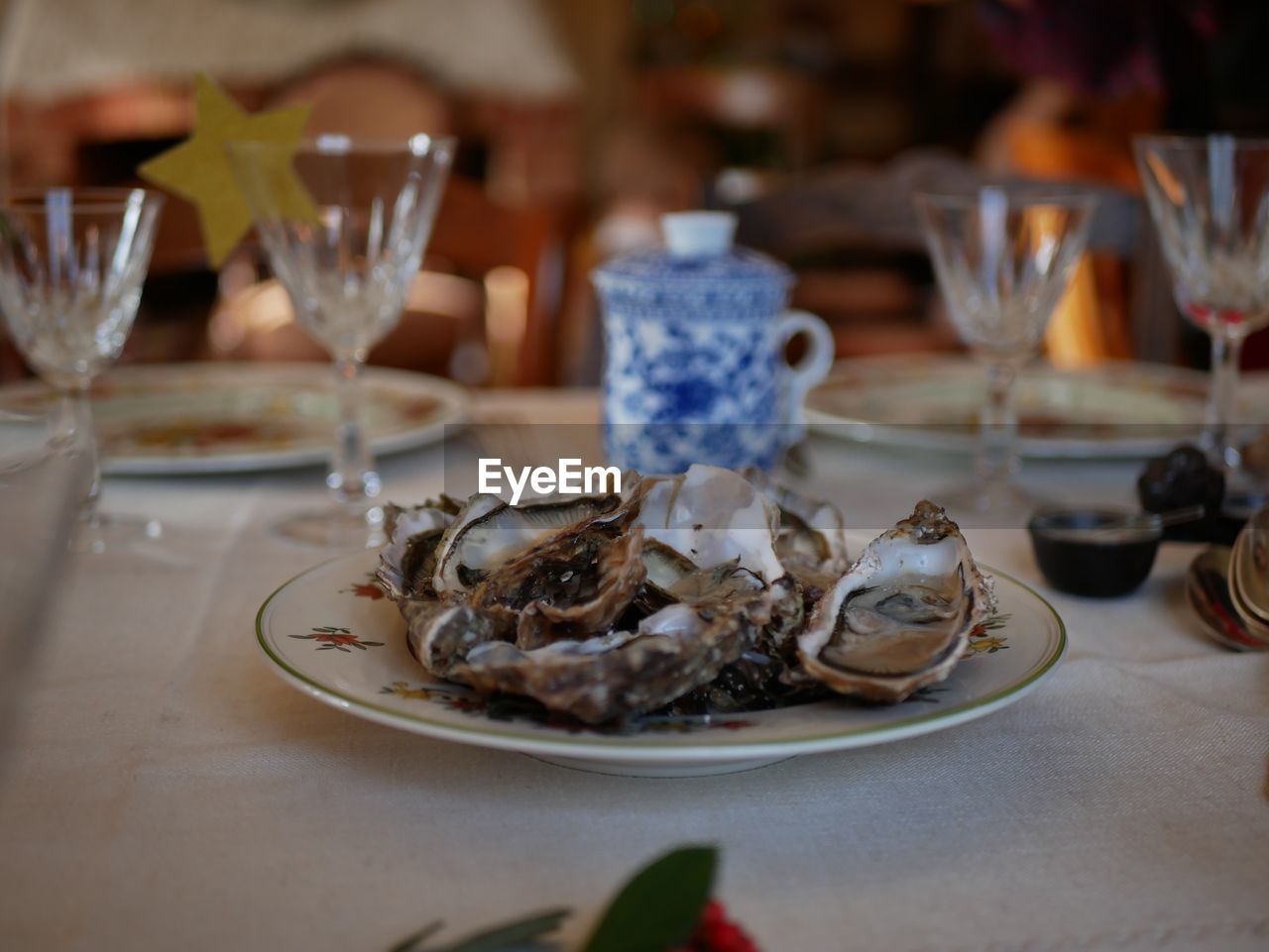 Close-up of oysters in plate on table