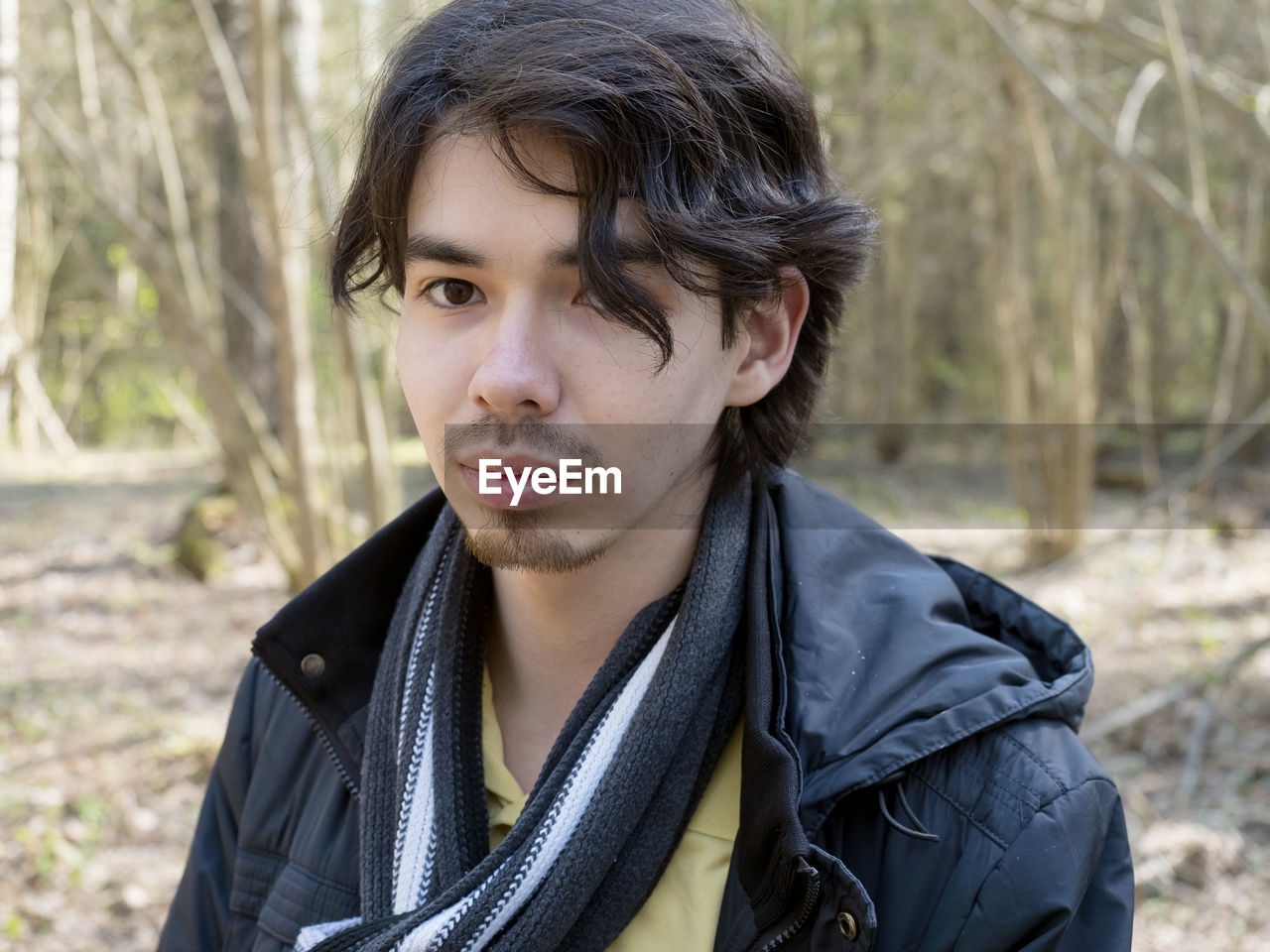 Portrait of young man in forest