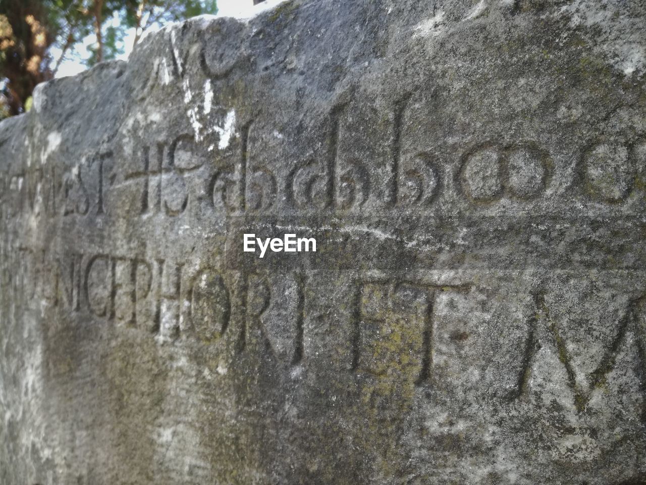 CLOSE-UP OF TEXT ON STONE