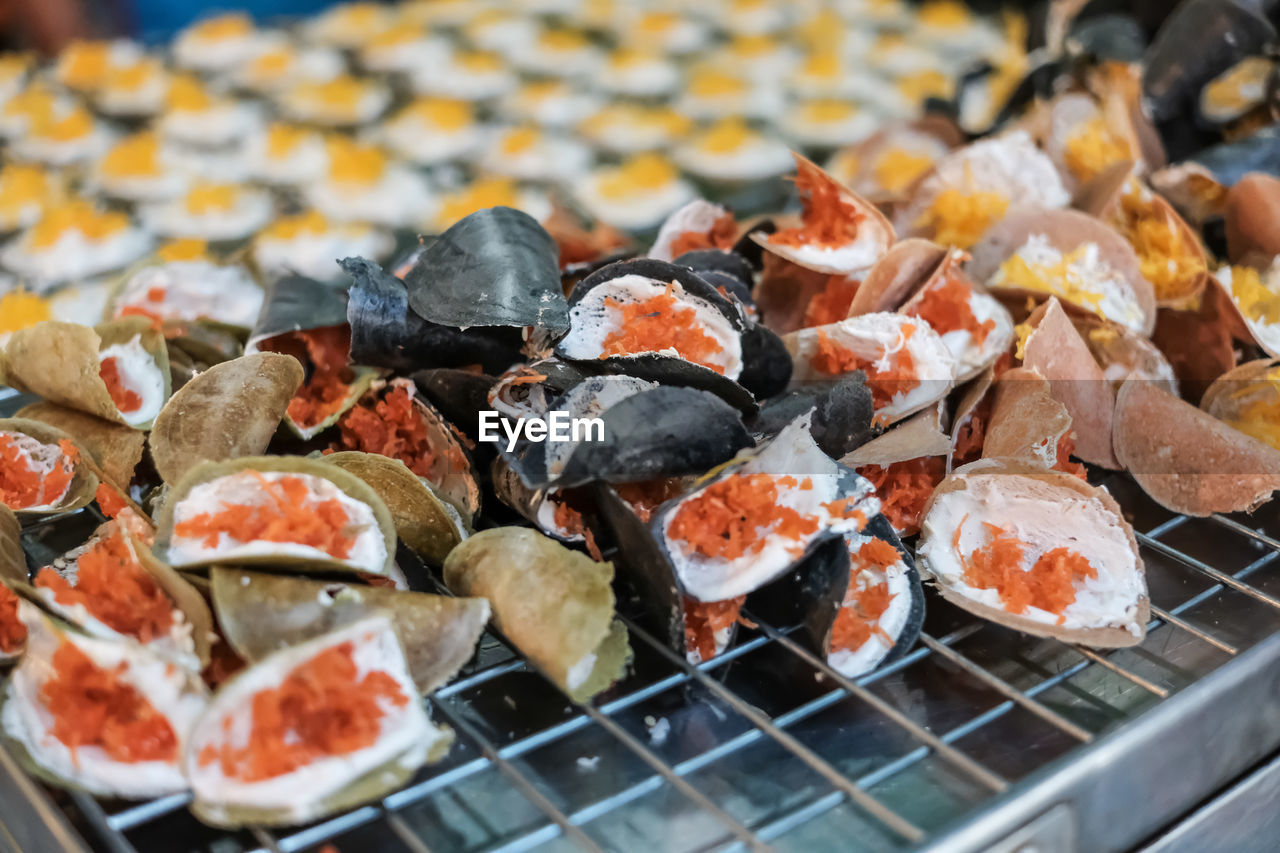 HIGH ANGLE VIEW OF FISH ON BARBECUE