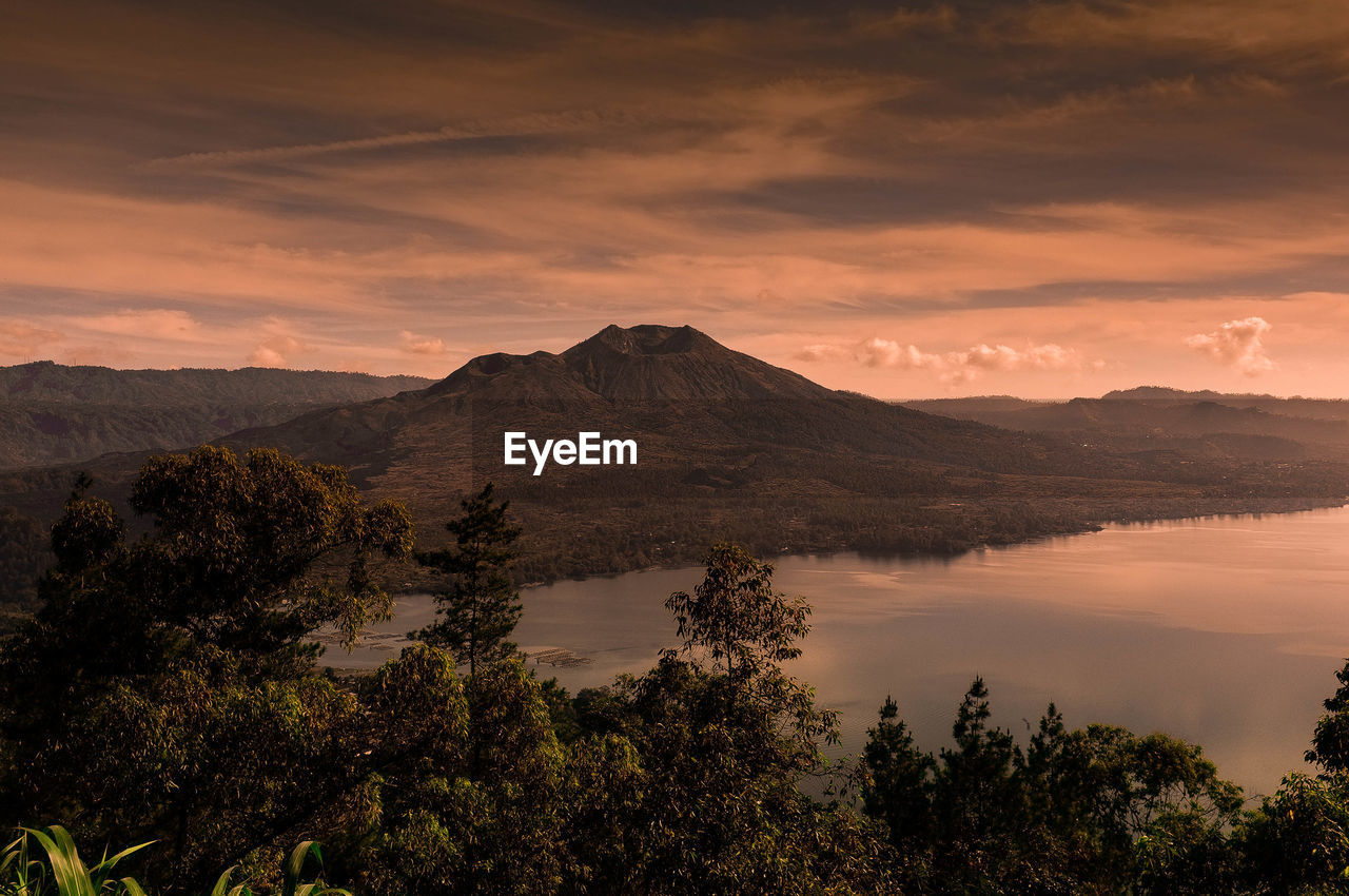 Scenic view of mountains against sky during sunset