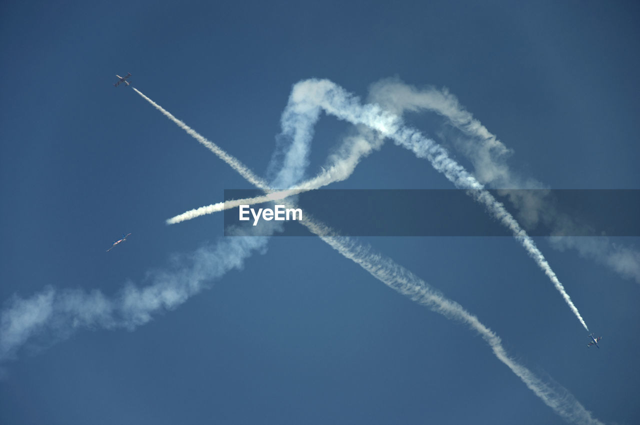 Low angle view of airplane flying in sky