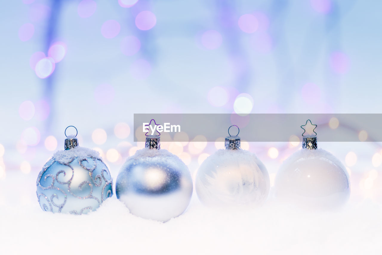 CLOSE-UP OF CHRISTMAS DECORATIONS HANGING ON WALL