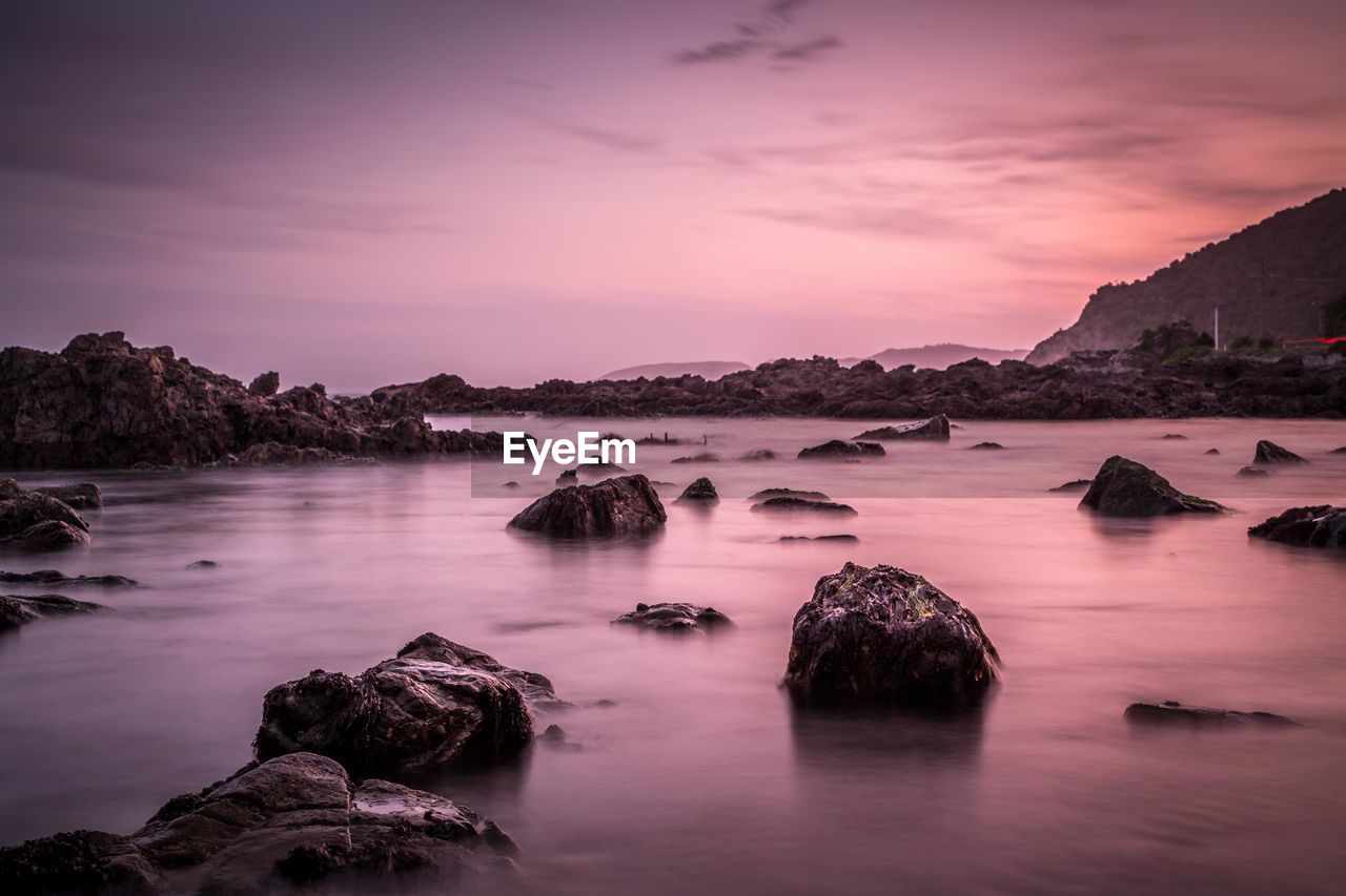 Scenic view of sea against sky at sunset