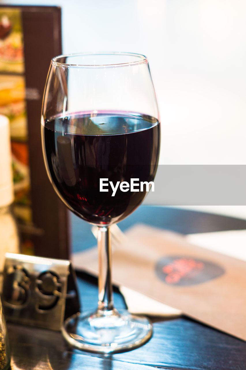 Close-up of wineglass on table