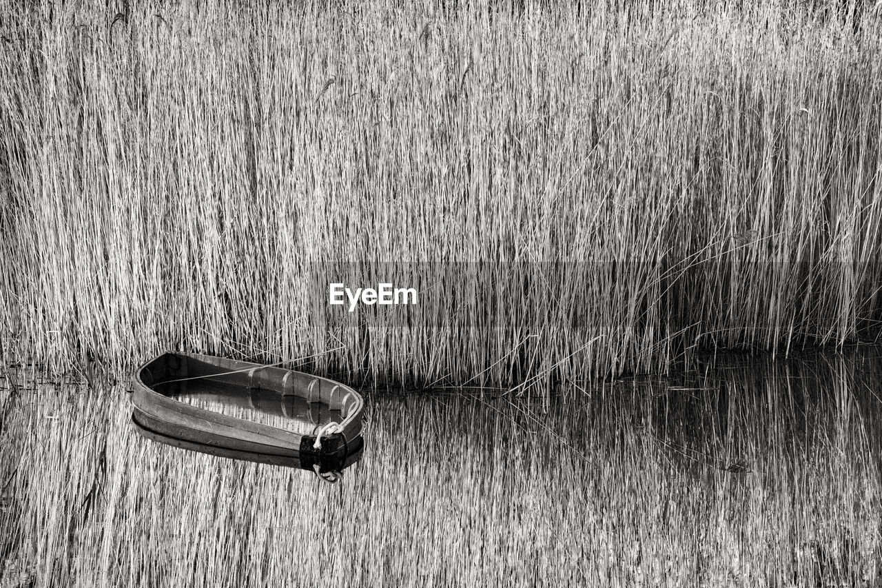 HIGH ANGLE VIEW OF BOAT ON LAND
