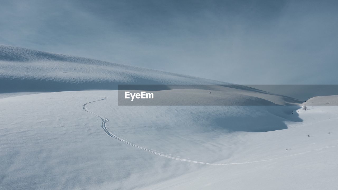 Idyllic shot of snow landscape against sky