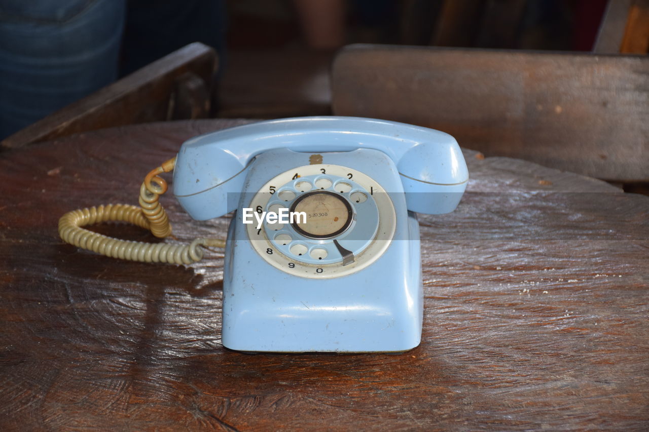 High angle view of telephone on table