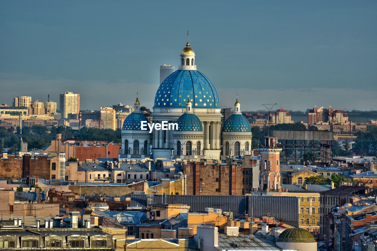 High angle view of city buildings against sky