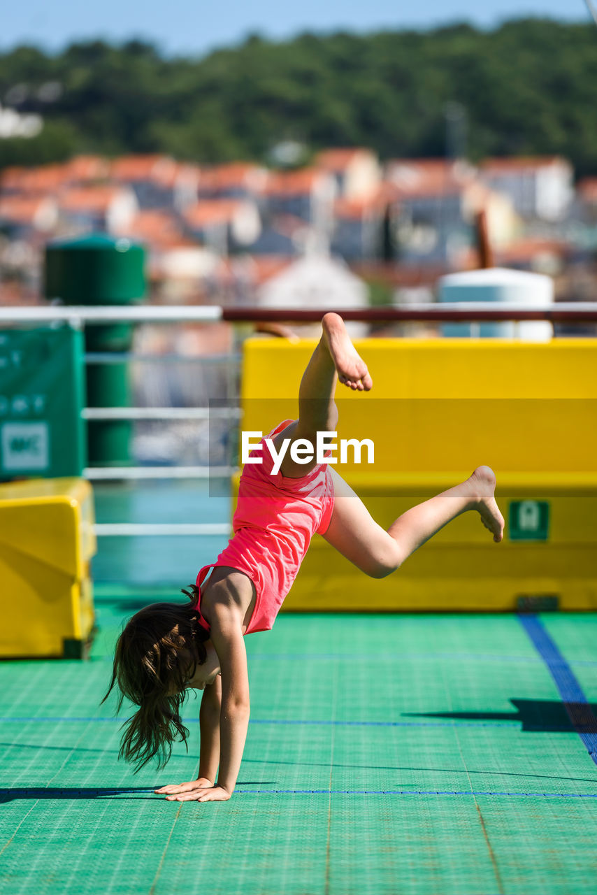 Girl doing stunt in boat