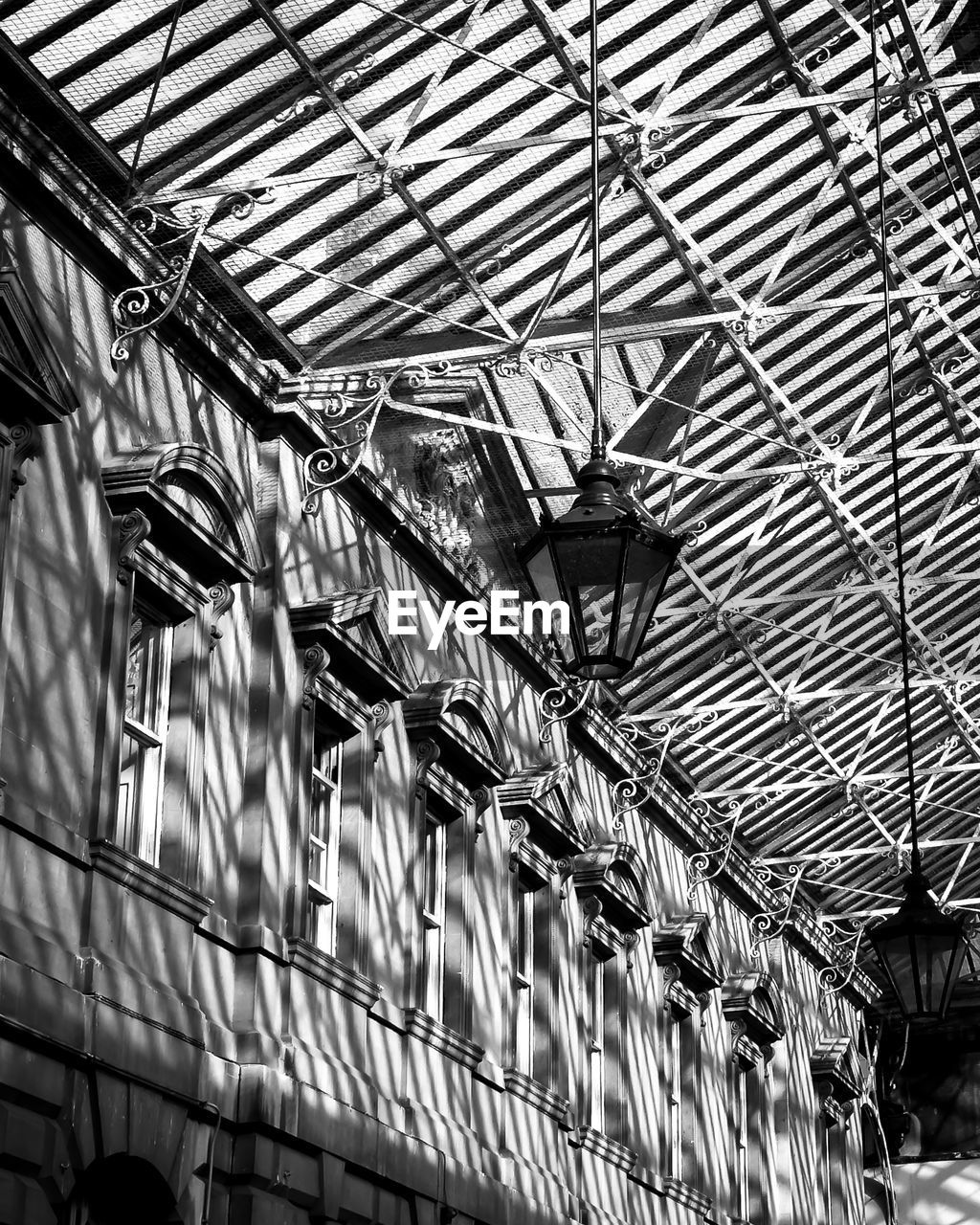 ceiling, architecture, built structure, black and white, indoors, monochrome, low angle view, monochrome photography, pattern, no people, day, metal, urban area, roof, industry, factory, line