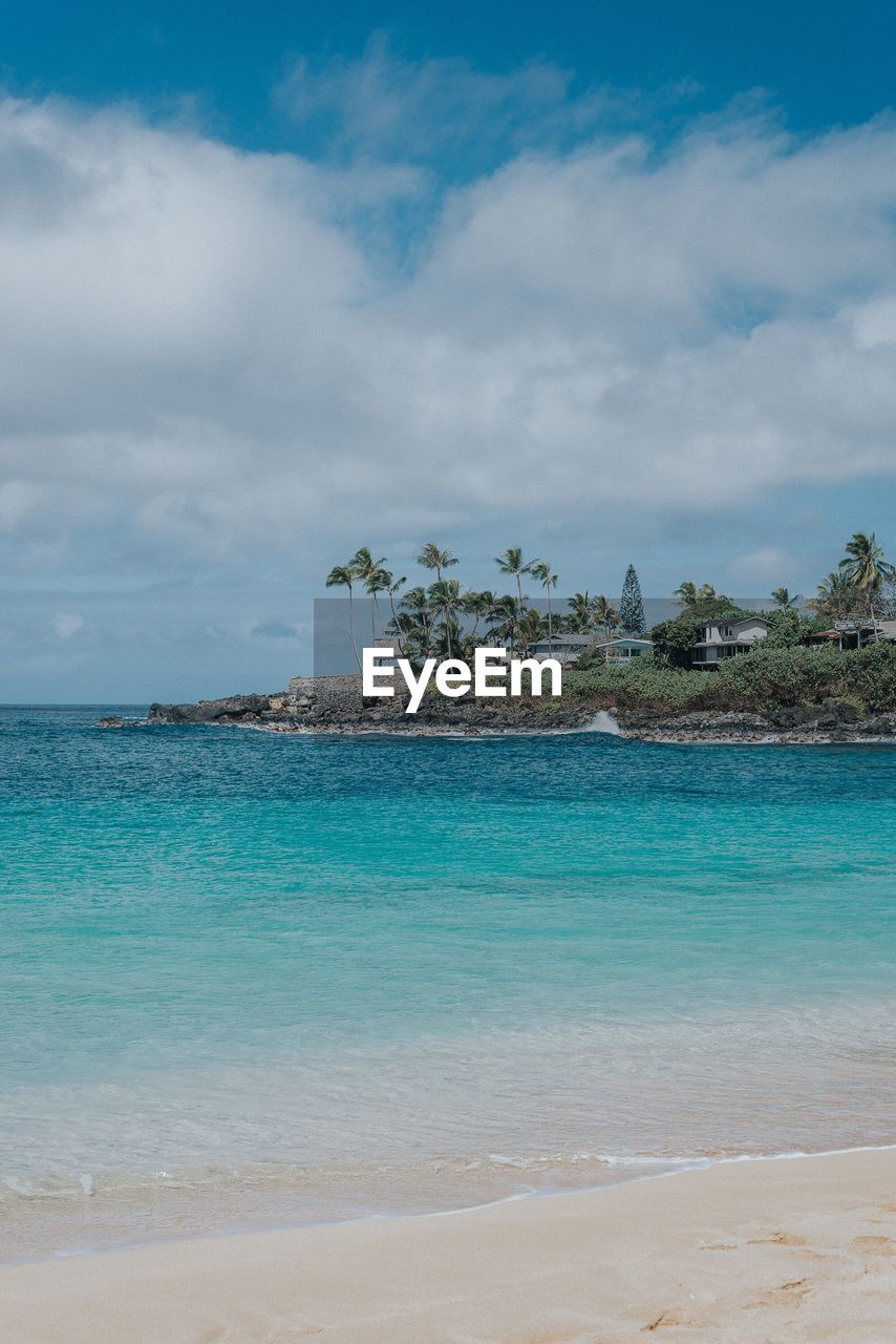 Scenic view of sea against cloudy sky