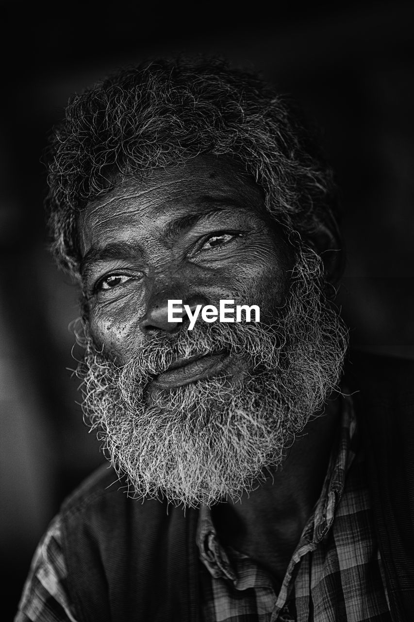 Close-up of thoughtful man looking away