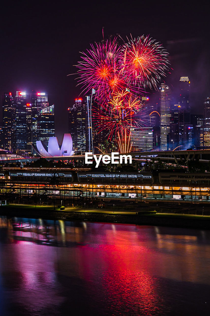 Fireworks and illuminated city at night