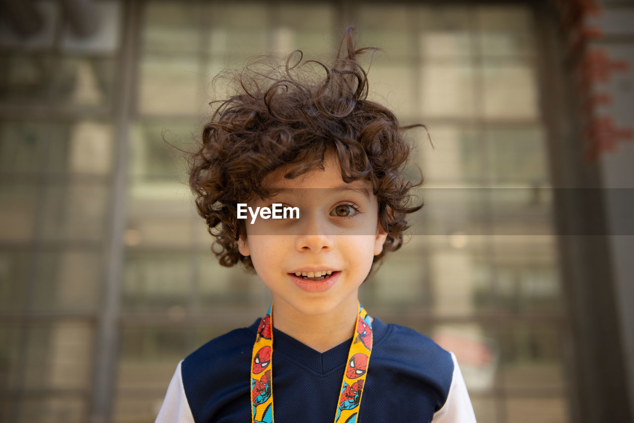 Portrait of happy boy with curly hair