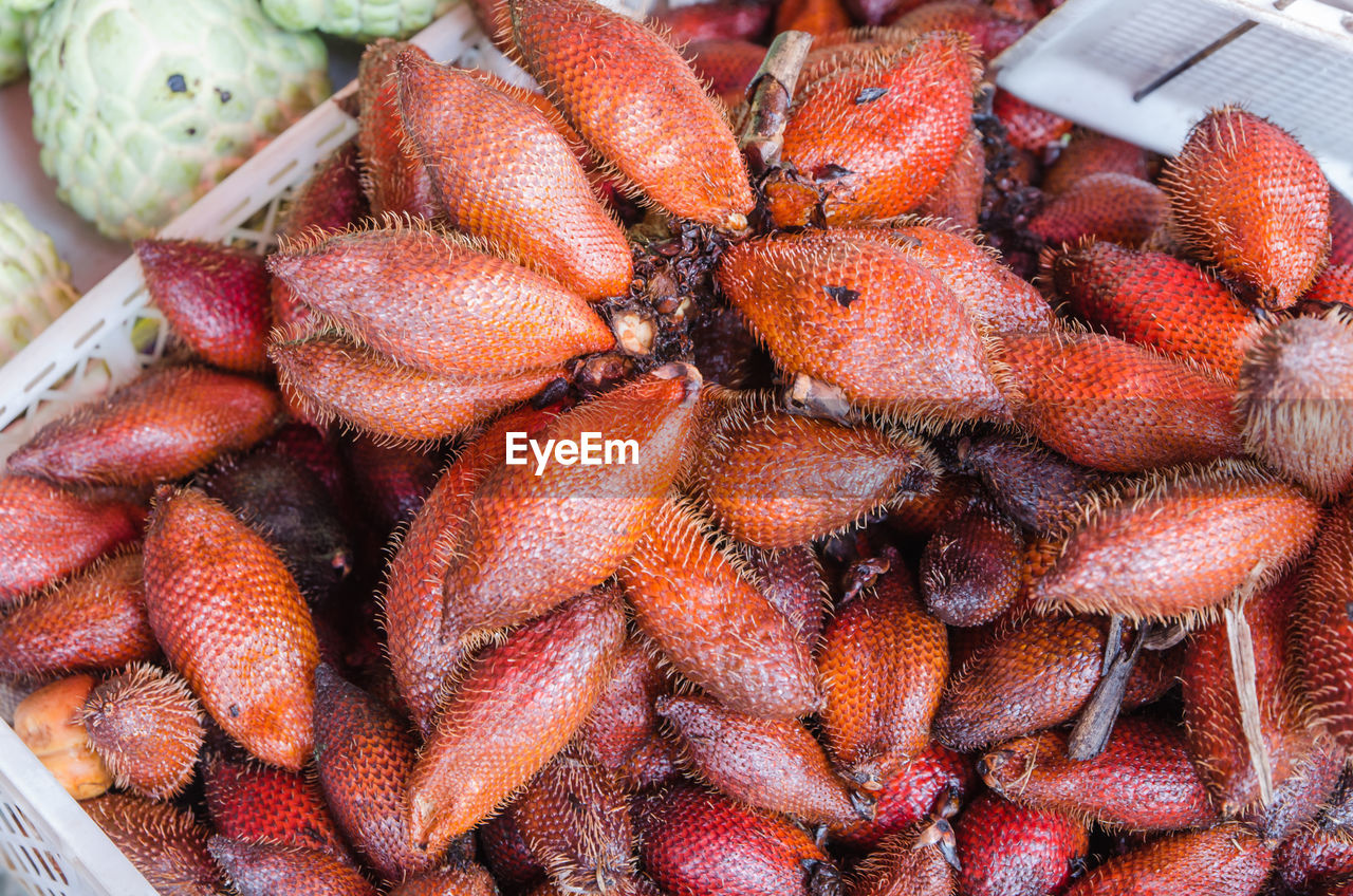 High angle view of snake fruits for sale at market
