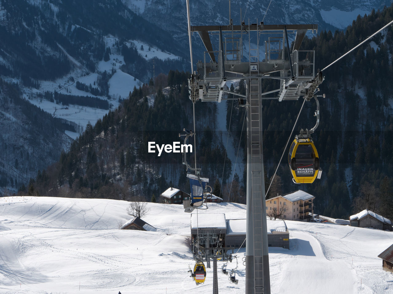 OVERHEAD CABLE CAR COVERED WITH SNOW