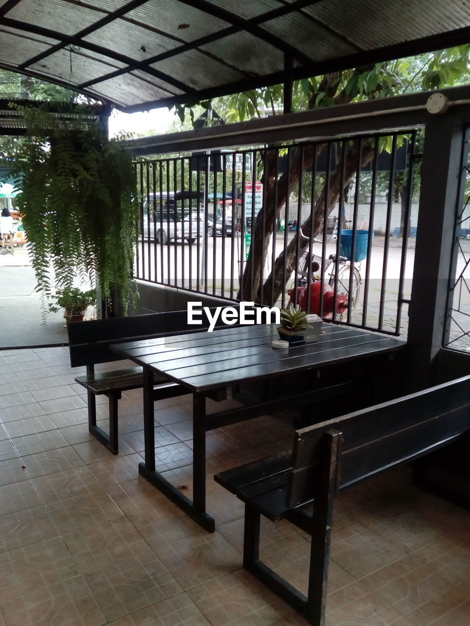 EMPTY CHAIRS AND TABLES IN BUILDING