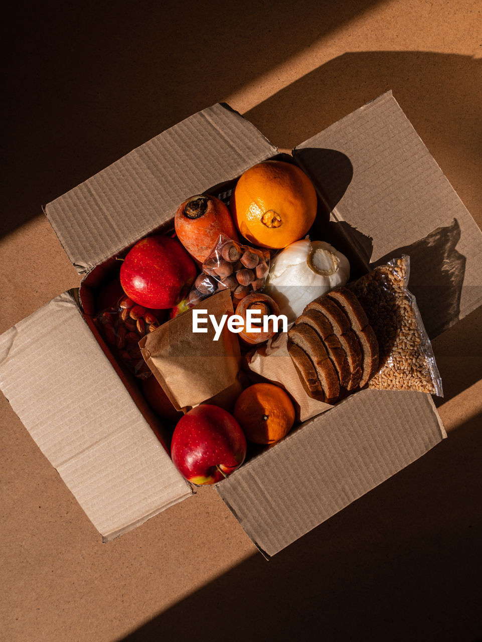 Healthy food delivery harsh shadow. take away products package donation box online shopping delivery