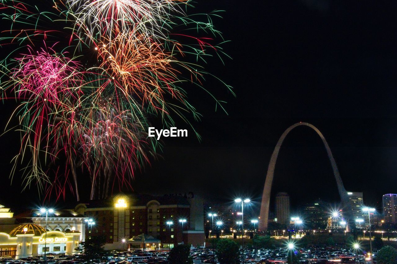 FIREWORK DISPLAY IN CITY AGAINST SKY