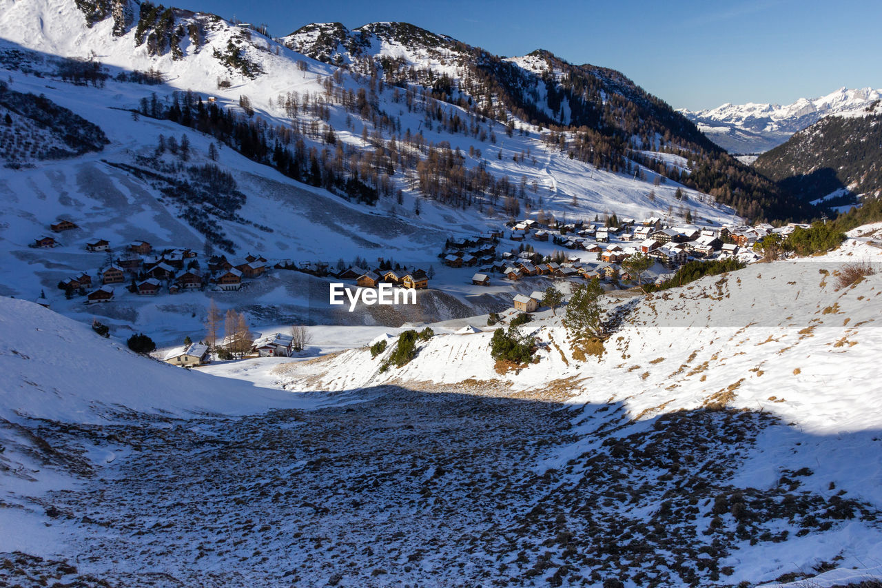 Scenic view of snow covered mountains