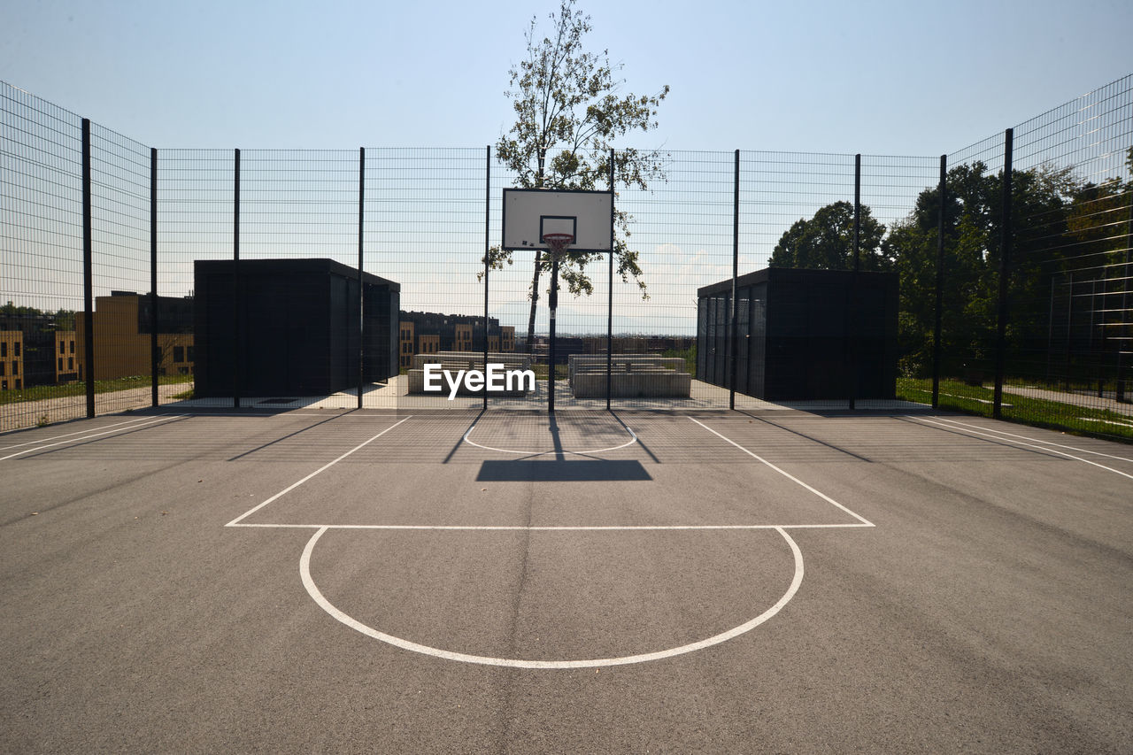 Basketball court with sky in background