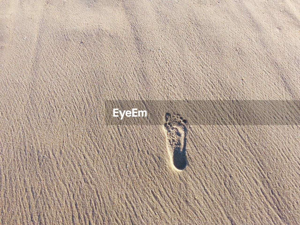 A footstep on beach sand