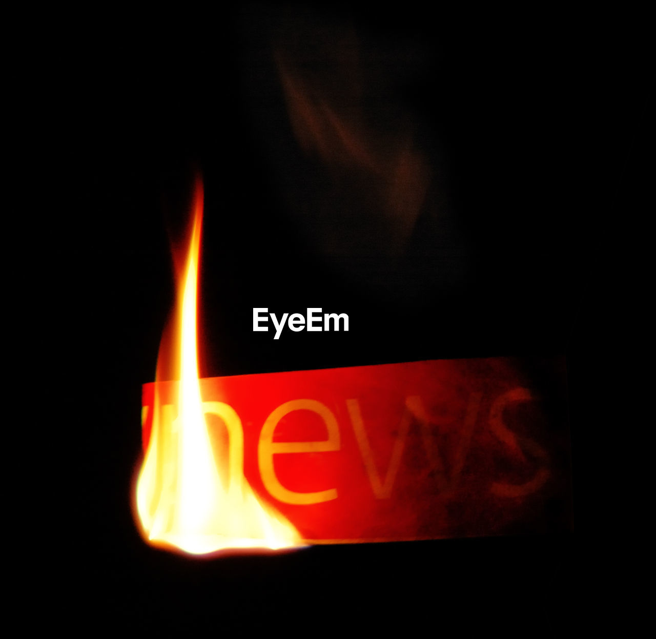 CLOSE-UP OF FIRE IN THE DARK