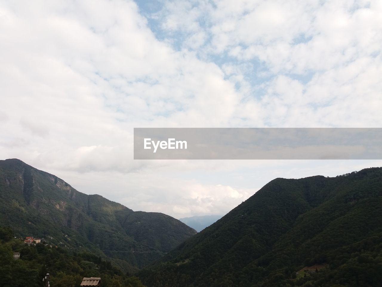 MOUNTAINS AGAINST SKY