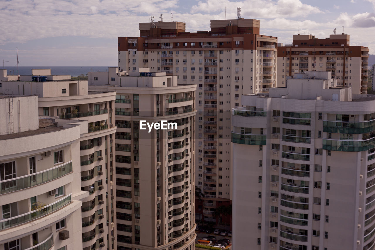 High angle view of buildings in city against sky