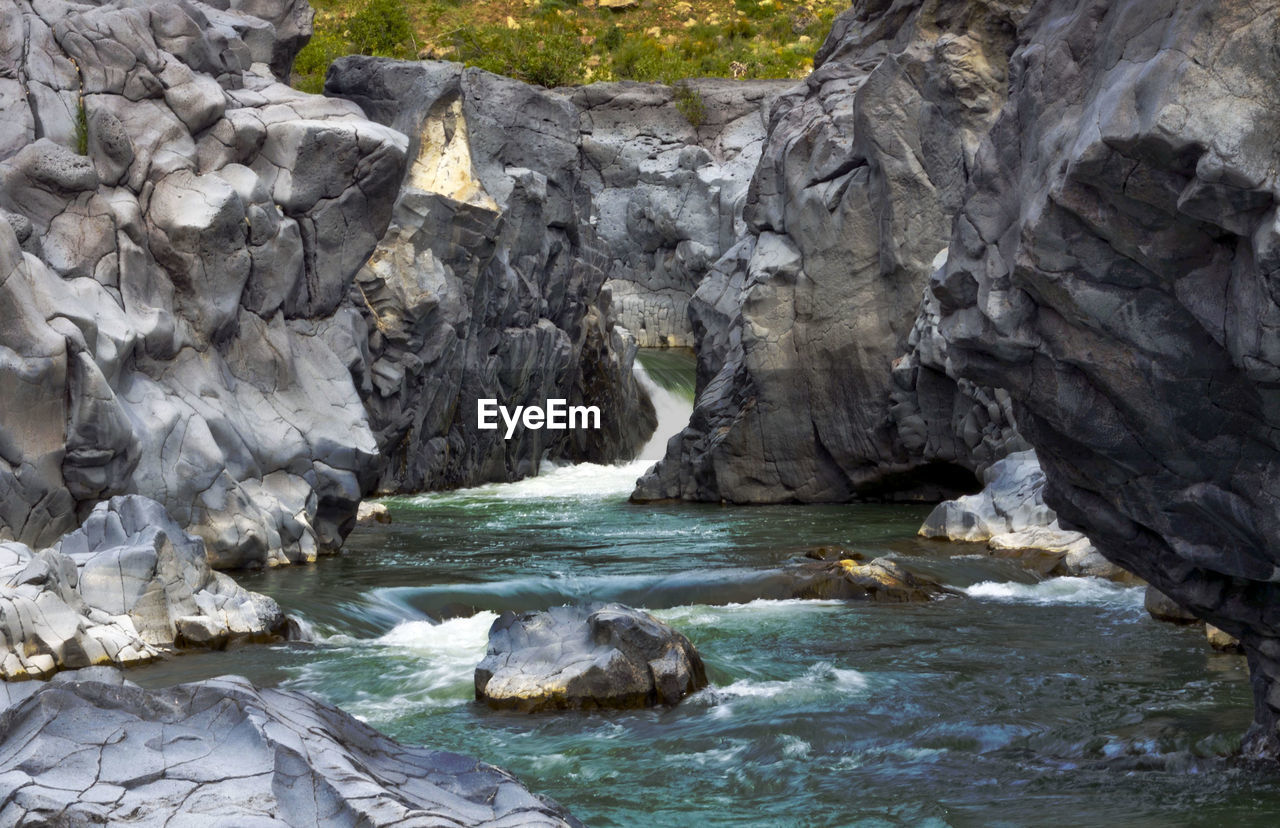 View of river amidst rock formations