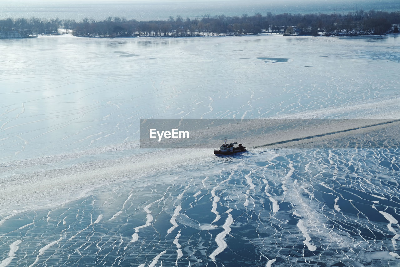 High angle view of snow on shore