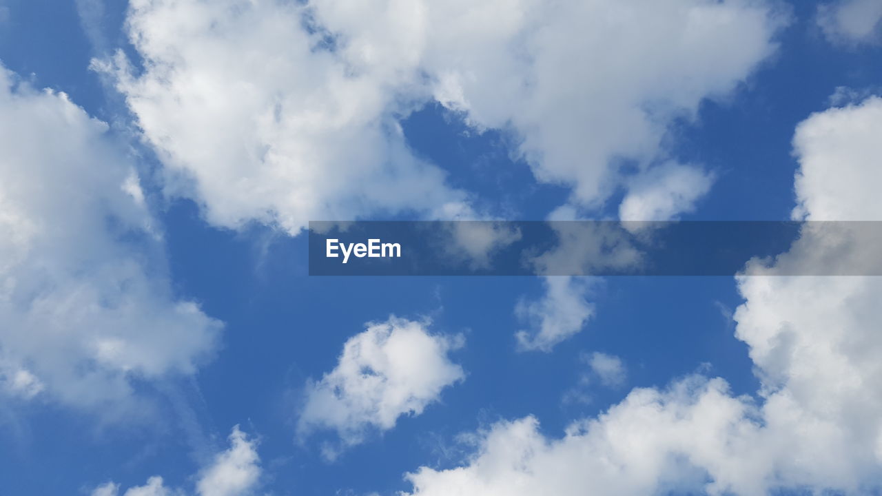 LOW ANGLE VIEW OF CLOUDS AGAINST BLUE SKY