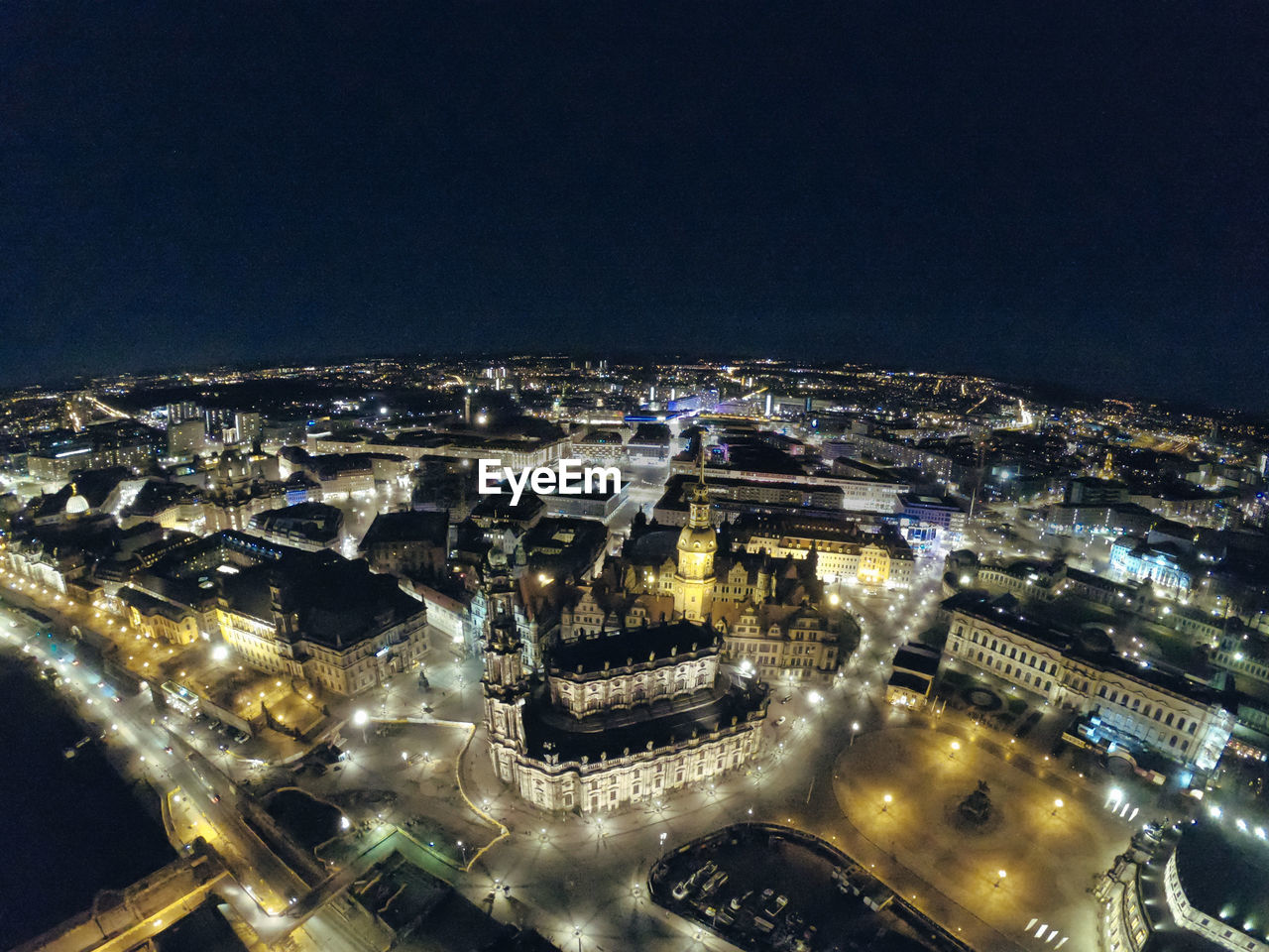 architecture, built structure, building exterior, city, night, illuminated, cityscape, aerial photography, metropolitan area, metropolis, high angle view, building, no people, aerial view, travel destinations, sky, nature, landmark, bird's-eye view, transportation, outdoors, city life, skyline, stadium, travel, road, residential district, street