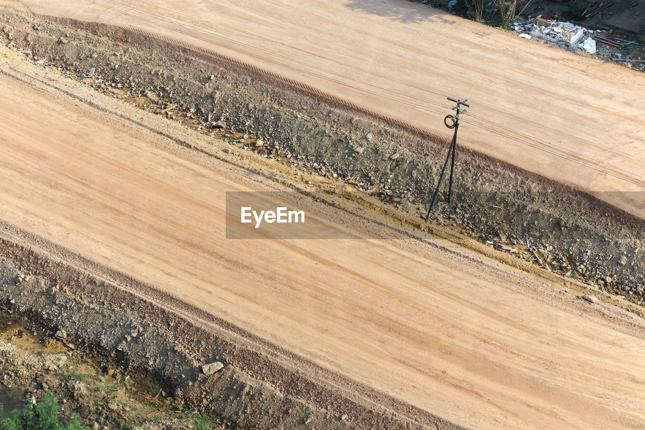 Aerial view of road under construction, laterite road or non-asphalt road in rural area