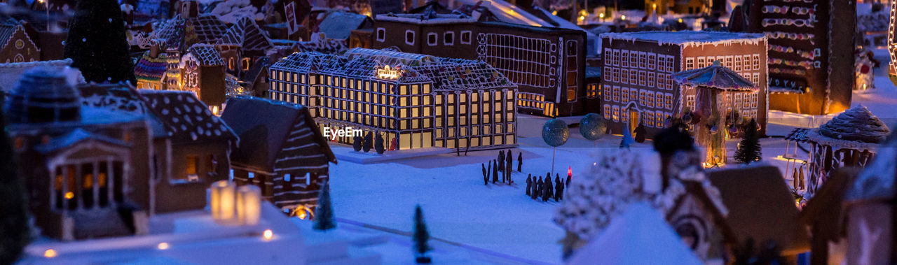 Panoramic view of illuminated city at night during winter