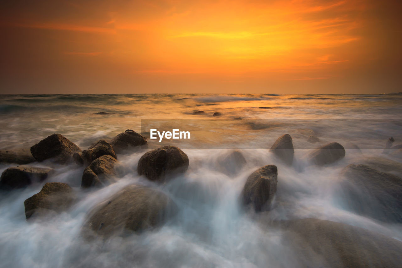 Scenic view of sea against sky during sunset