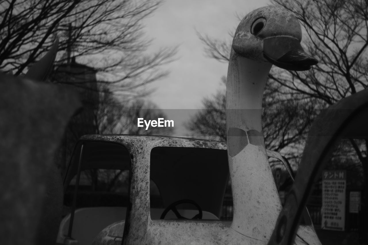 Close-up of abandoned swan boat