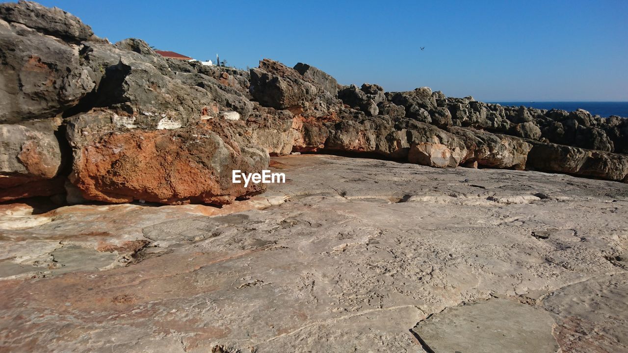 ROCK FORMATIONS AGAINST CLEAR SKY