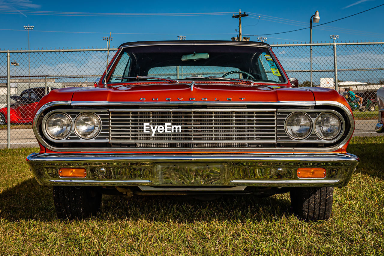 VINTAGE CAR ON FIELD