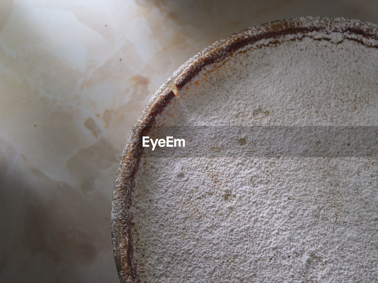 Directly above view of flour in plate on table