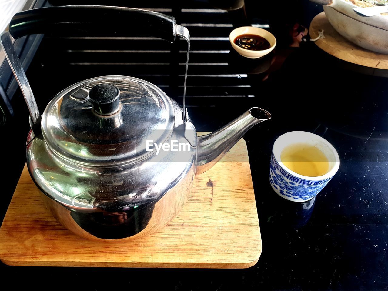 food and drink, table, drink, indoors, cup, mug, high angle view, household equipment, still life, tea, refreshment, food, hot drink, kitchen utensil, no people, teapot, freshness, tea cup, close-up, wood, coffee, coffee cup, crockery