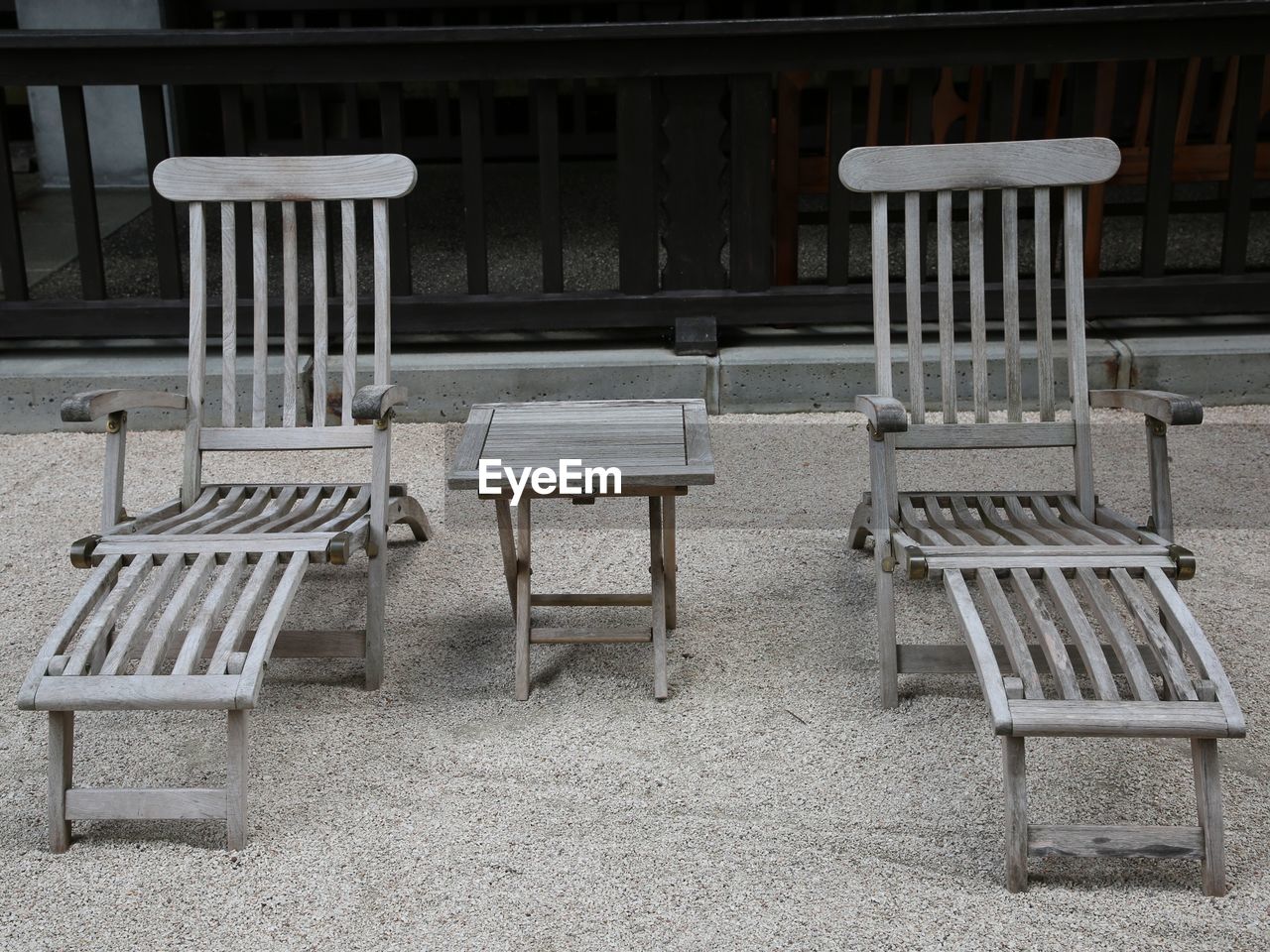 EMPTY CHAIRS AND TABLES AT CAFE