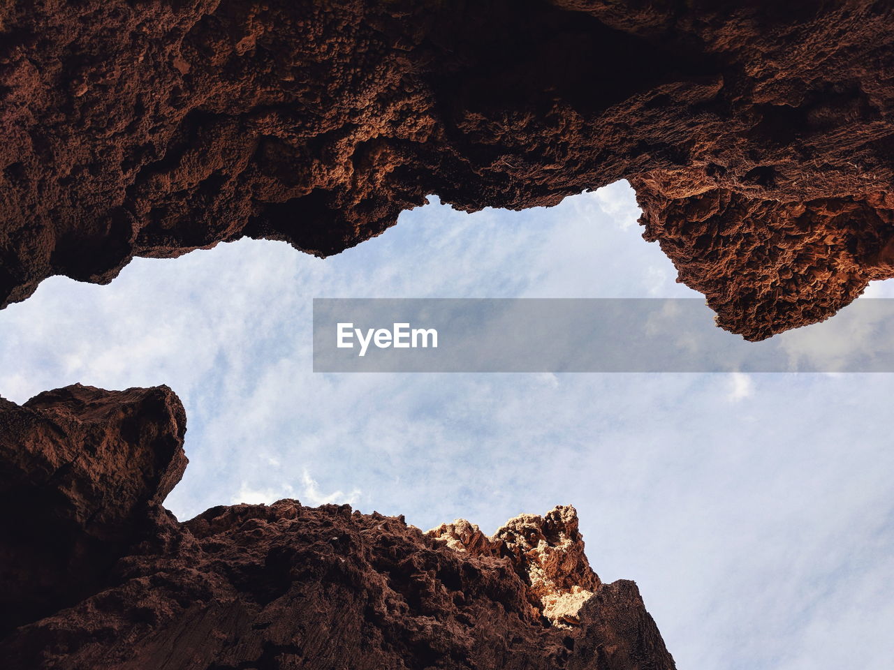 Low angle view of rock formations against sky